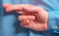 Fingers crossed behind back 6 reasons we suck at spotting liars