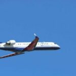 white and red air plane in flight